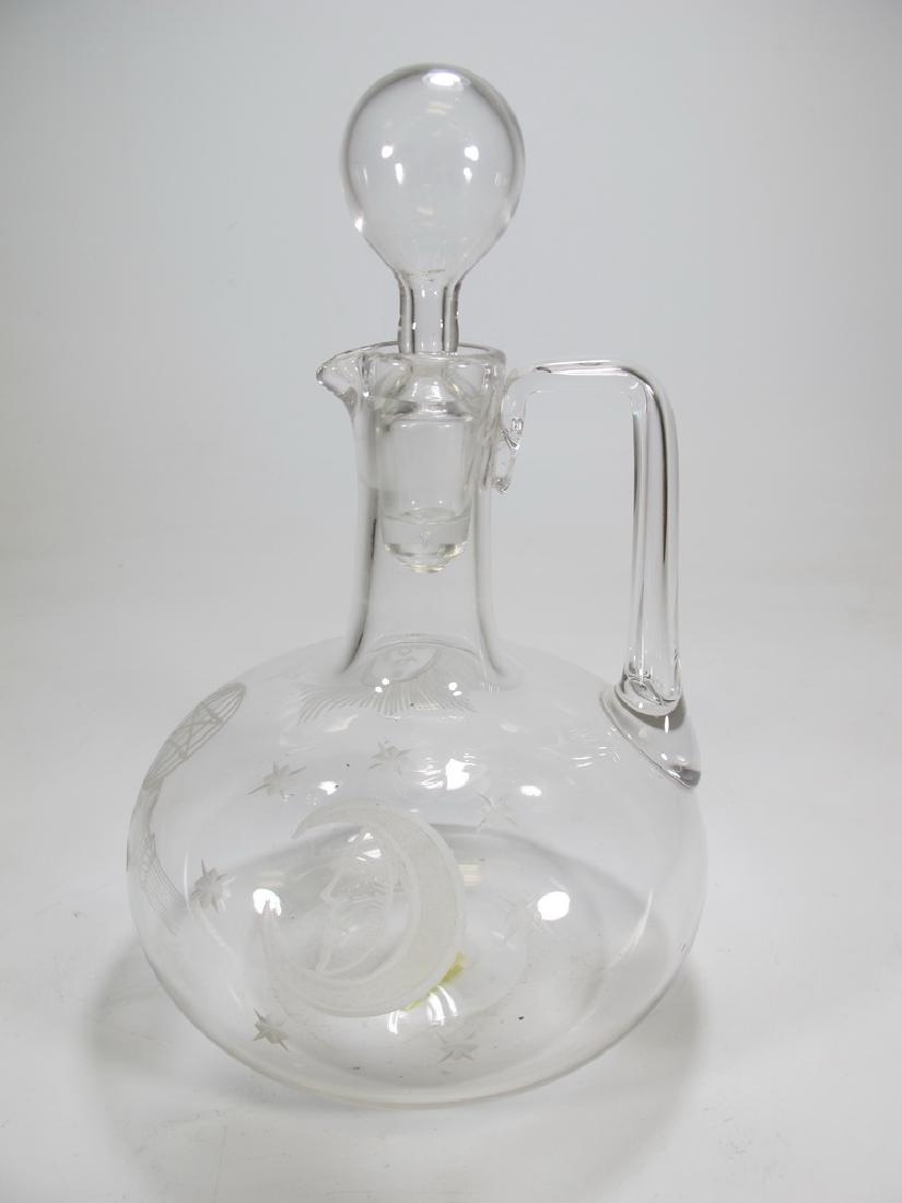 Vintage Masonic glass decanter: Vintage glass decanter. Masonic emblems engraved. Blown glass applied handle. 8 1/2" H x 5 1/4" W. Shipping in USA or International please contact both UPS stores for quote: James Lawrence, UPS Store 