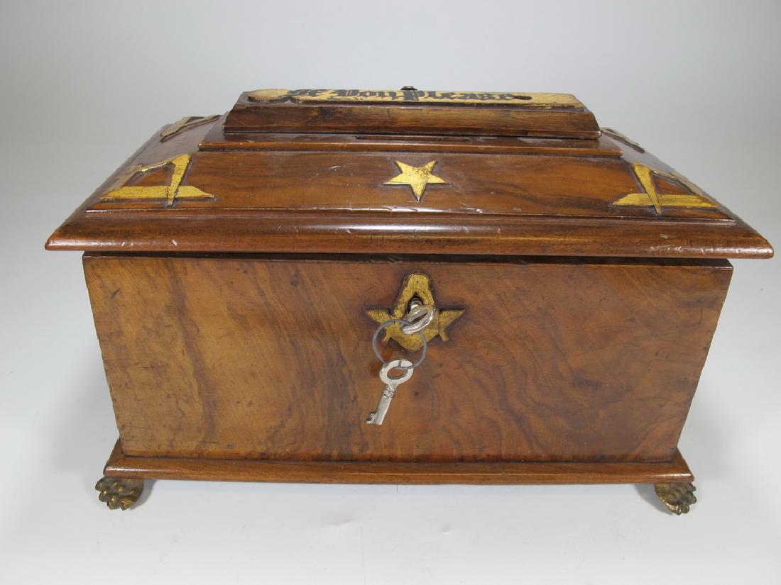 Antique Masonic Georgian Alms wood box: Antique Masonic Georgian Alms wood box with Masonic bronze symbols on the lid. 6" H x 10" W x 6" D. Shipping in USA or International please contact both UPS stores for quote: James Lawrence, UPS Store