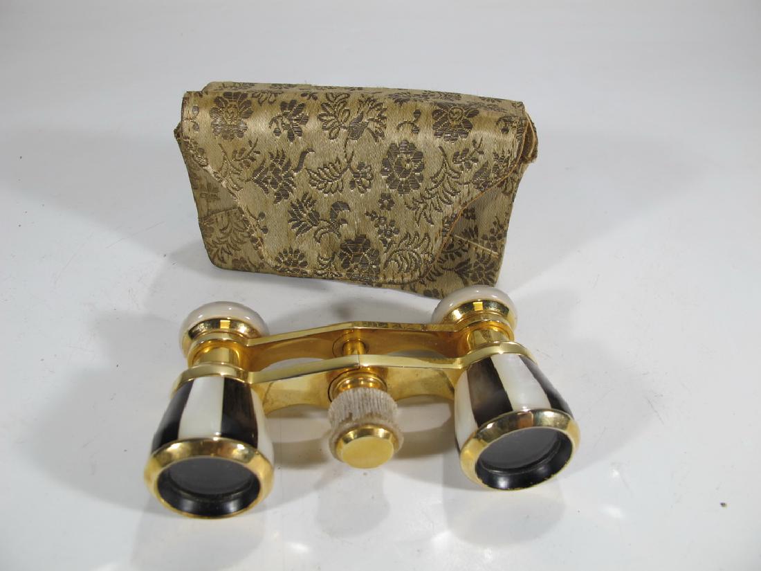 Vintage golden & mother of pearl opera glasses: Vintage golden & mother of pearl opera glasses. 2 1/8" H x 3 3/4" W x 1 1/8" D. Shipping in USA or International please contact both UPS stores for quote: James Lawrence, UPS Store 4356, 954-463-0444,
