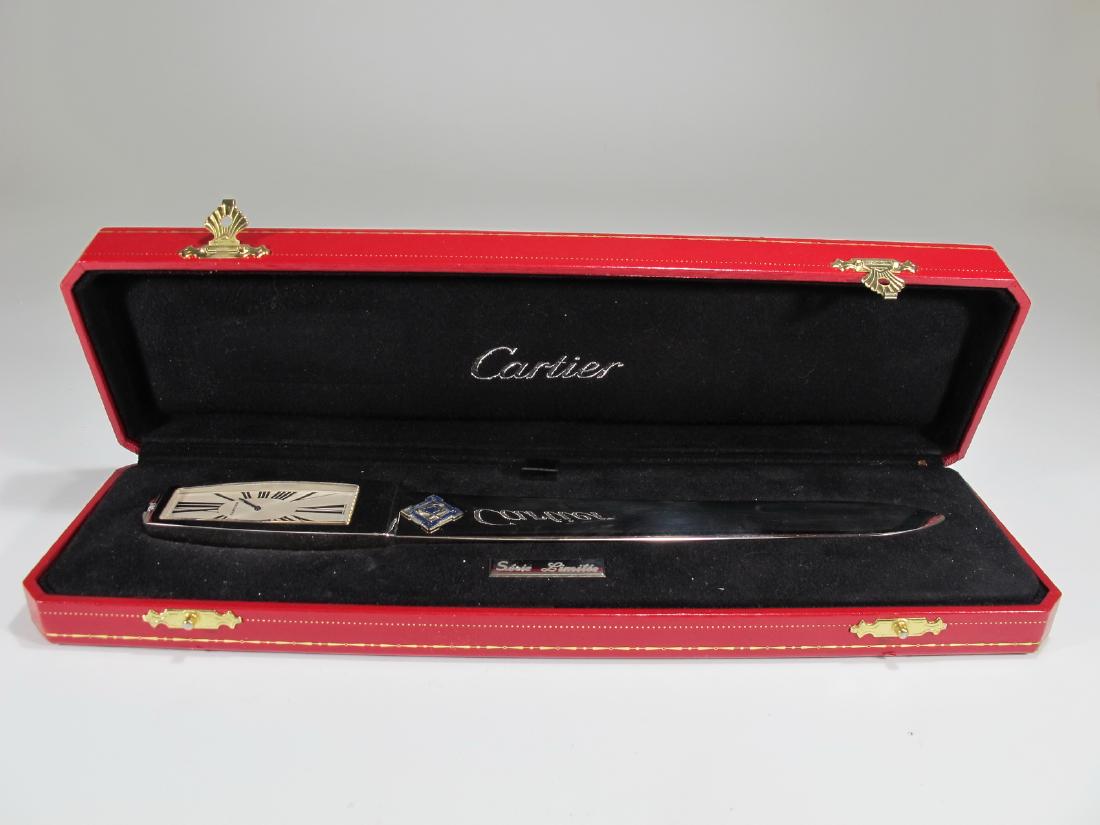 Cartier stainless steel letter opener: Cartier stainless steel letter opener, probably silver Freemasonry symbol applied to the letter opener. Elongated white dial, Roman numeral clock, stainless steel case and stainless steel letter opene