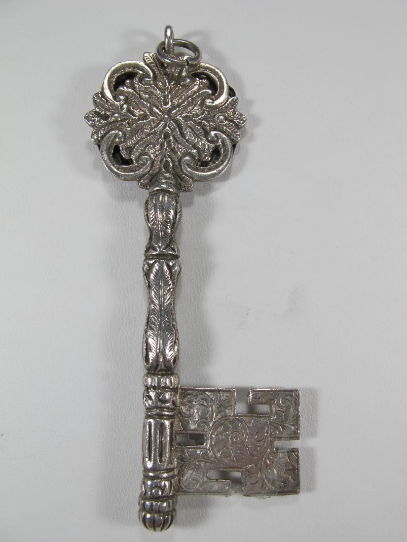 Antique Masonic Treasurer silver key jewel. Engraved:: ntique Masonic Treasurer silver key jewel. Engraved: Presented by Wor.Bro.Frank Burnett First Treasurer January 1923. 3 7/8 in H x 1 1/2 in W. Weight: 44 grams (1t oz 8.292657 dwt). Shipping in USA or