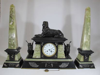 AD Mougin, 19th C French Orientalist clock set: AD Mougin, 19th C French Orientalist bronze, marble and green onyx clock set. Clock: 17 in H x 19 3/4 in W x 7 1/4 in D, Obelysc: 22 5/8 in H x 6 3/4 in W x 5 1/4 in D. Shipping in USA or