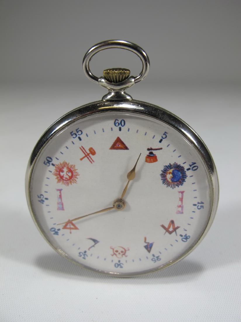Longchamp Masonic open face nickelchrome pocket watch: Longchamp Masonic open face nickelchrome pocket watch with Masonic symbols by the numerals. 2 3/8 in H x 1 7/8 in W. Shipping in USA or International please contact for quote: James Lawrence UPS Store