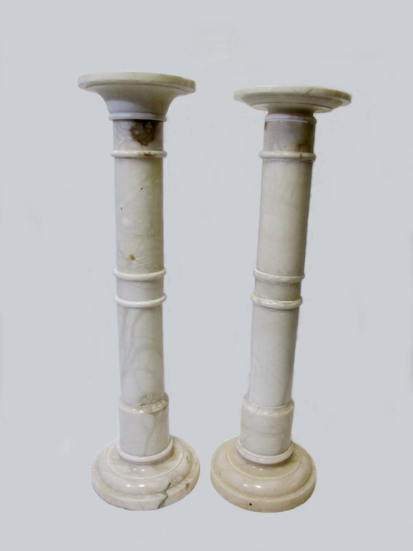 Lot of 2 vintage alabaster pedestals: Lot of 2 vintage alabaster pedestals. 39 1/2 in H x 10 1/8 in W top x 113 /8 W bottom and 38 3/4 in H x 10 1/8 in W top x 10 7/8 in W bottom. Shipping in USA or International please contact both UPS s