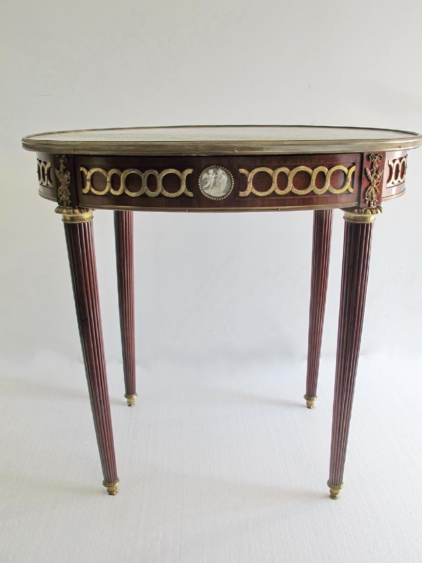 Antique French bronze, porcelain & marble oval table: Antique French bronze, porcelain & marble oval table. 31 3/8 in h x 31 7/8 in W x 22 3/8 in D. Shipping in USA or International please contact for quote: James Lawrence UPS Store 4356 - 954-463-0444 F