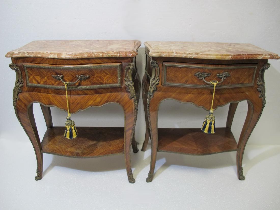 Antique French pair of marble top side tables: Antique French pair of marble top side tables with bronze handles and details. 26 3/8 in H x 22 3/4 in W x 13 1/4 in D. Shipping in USA or International please contact for quote both UPS stores: 1) : 