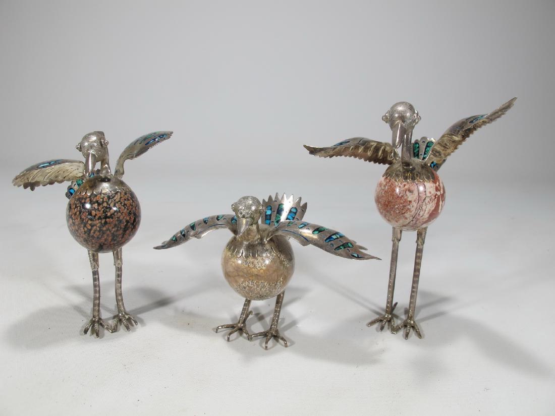 3 Taxco Mexico sterling 925 and stone birds statues: 3 Mexican sterling 925 and stone birds statues with abalone details. 4 1/2 in H x 3 1/4 in W x 3 1/4 in D, 3 3/4 in H x 3 in W x 2 3/8 in D and 2 7/8 in H x 4 1/4 in W x 3 1/8 in D. Shipping in USA or