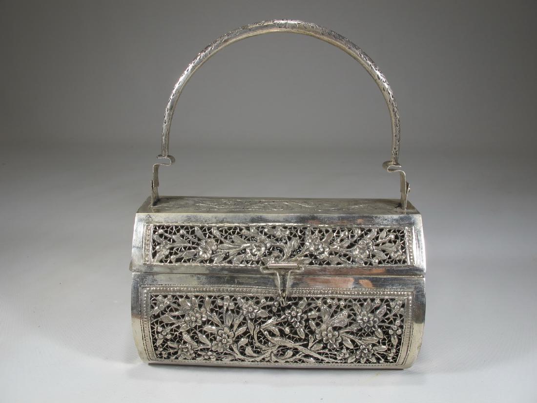 Chinese Export silver bag: Antique Chinese Export silver bag. 8 in H x 6 3/8 in W x 3 1/2 in D including handle. 4 1/2 in H x 6 3/8 in W x 5 1/4 in D with the handle down. Weight: 382.9 grams (12t oz 6.210421 dwt). Shipping in