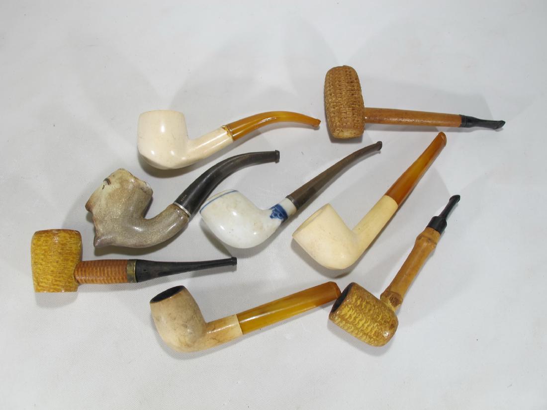 Vintage set of 8 American, French & English pipes: Vintage set of 8 American, French & English pipes, made in meerschaum, porcelain and corn cob from Missouri. Biggest: 1 7/8 in H x 5 7/8 in W. Shipping in USA or International please contact for quote