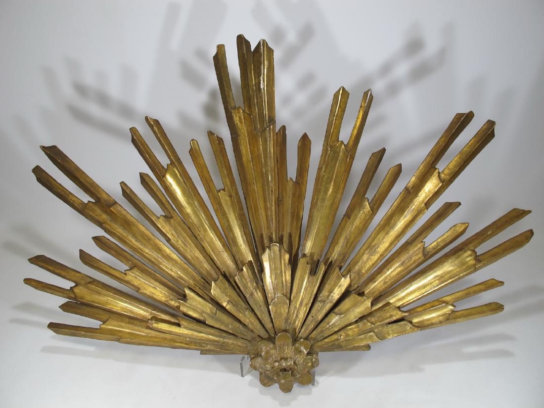Vintage gilded wood sunburst wall ornament: Vintage gilded wood sunburst wall ornament. 24 in H x 34 1/2 in W x 3 1/8 in D. Shipping in USA or International please contact for quote both UPS stores: 1) : James Lawrence UPS Store 4356 - 954-463-
