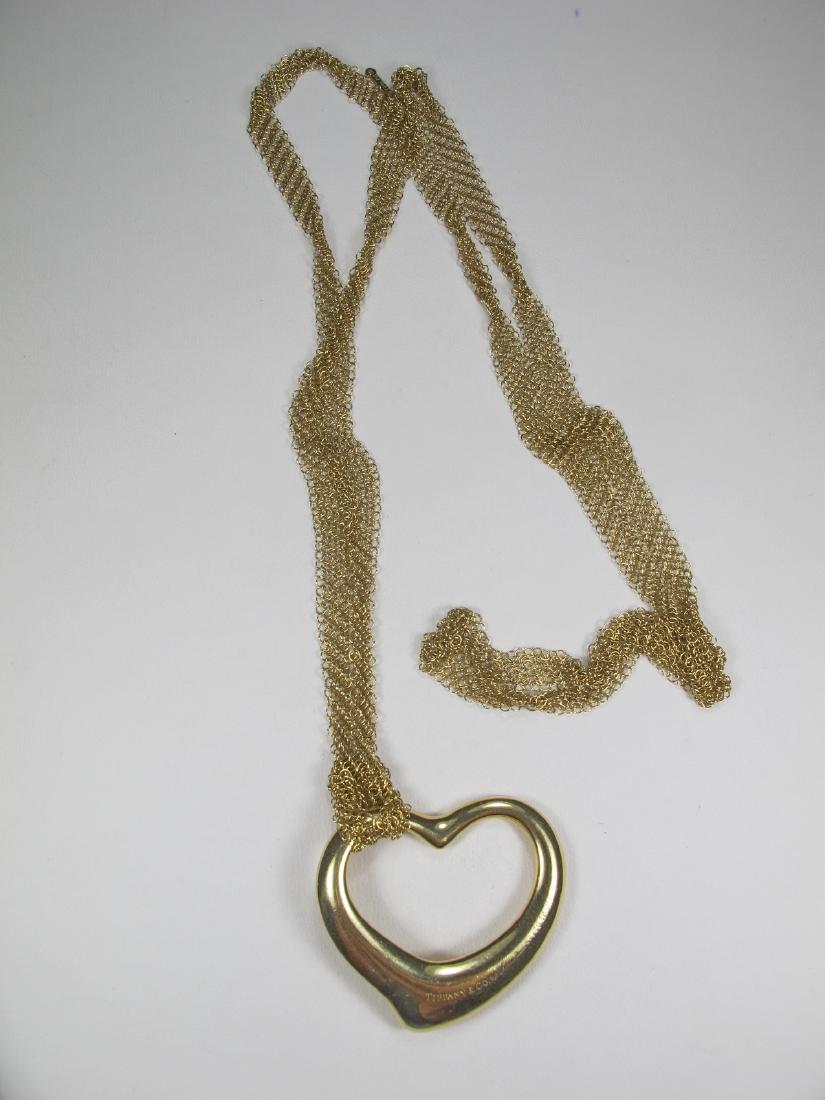 18k gold Tiffany & Co Elsa Peretti open heart necklace: 18k gold Tiffany & Co Elsa Peretti open heart necklace. Heart: 1 1/4 in H x 1 3/8 in W. Weight: 22.1 grams (0t oz 14.21063 dwt). Shipping in USA or International please contact for quote both UPS stor