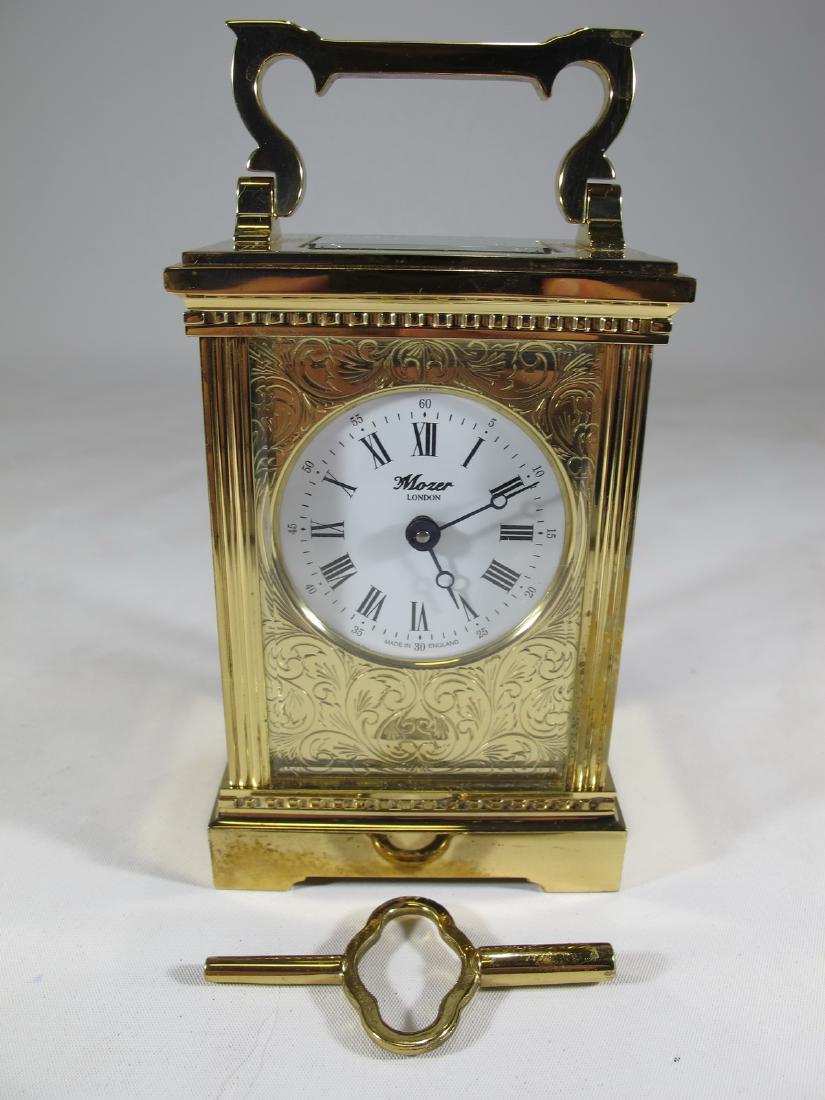 Mozer, London bronze & crystal carriage clock: Mozer, London bronze & crystal carriage clock. 6 3/8 in H x 3 1/4 in W x 2 1/2 in D including top handle. Shipping in USA or International please contact for quote both UPS stores: 1) : James Lawrence