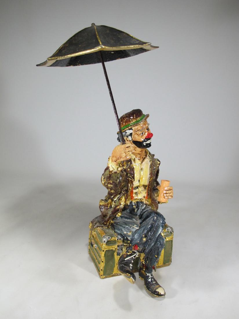 Ron LEE hand painted clown sculpture on an onyx base: Ron LEE hand painted clown sculpture on an onyx base. 15 1/2 in H total. 11 1/8 in H x 5 5/8 in W x 6 5/8 in D without the umbrella. Umbrella: 6 1/2 in H x 6 1/2 in W. Shipping in USA or International