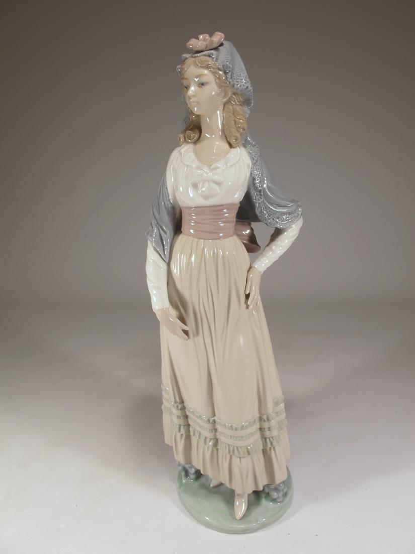 Lladro Goya lady Dama Goyesca porcelain statue: Lladro Goya lady Dama Goyesca porcelain statue. Circa 1982 and retired in 1990. Sculptor Vicente Martinez. 12 5/8 in h x 3 3/4 in W x 4 in D. Shipping in USA or International please contact for quote 