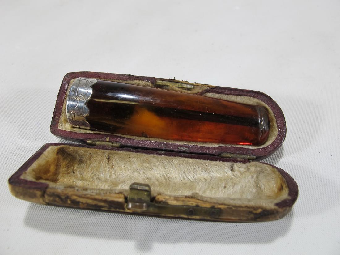 Antique English amber & silver cigar holder with case: Antique English amber & silver cigar holder with case. 2 5/8 in long. Case: 3 in H x 1 in W x 7/8 in D. Shipping in USA or International please contact for quote both UPS stores: 1) : David Reiser UPS