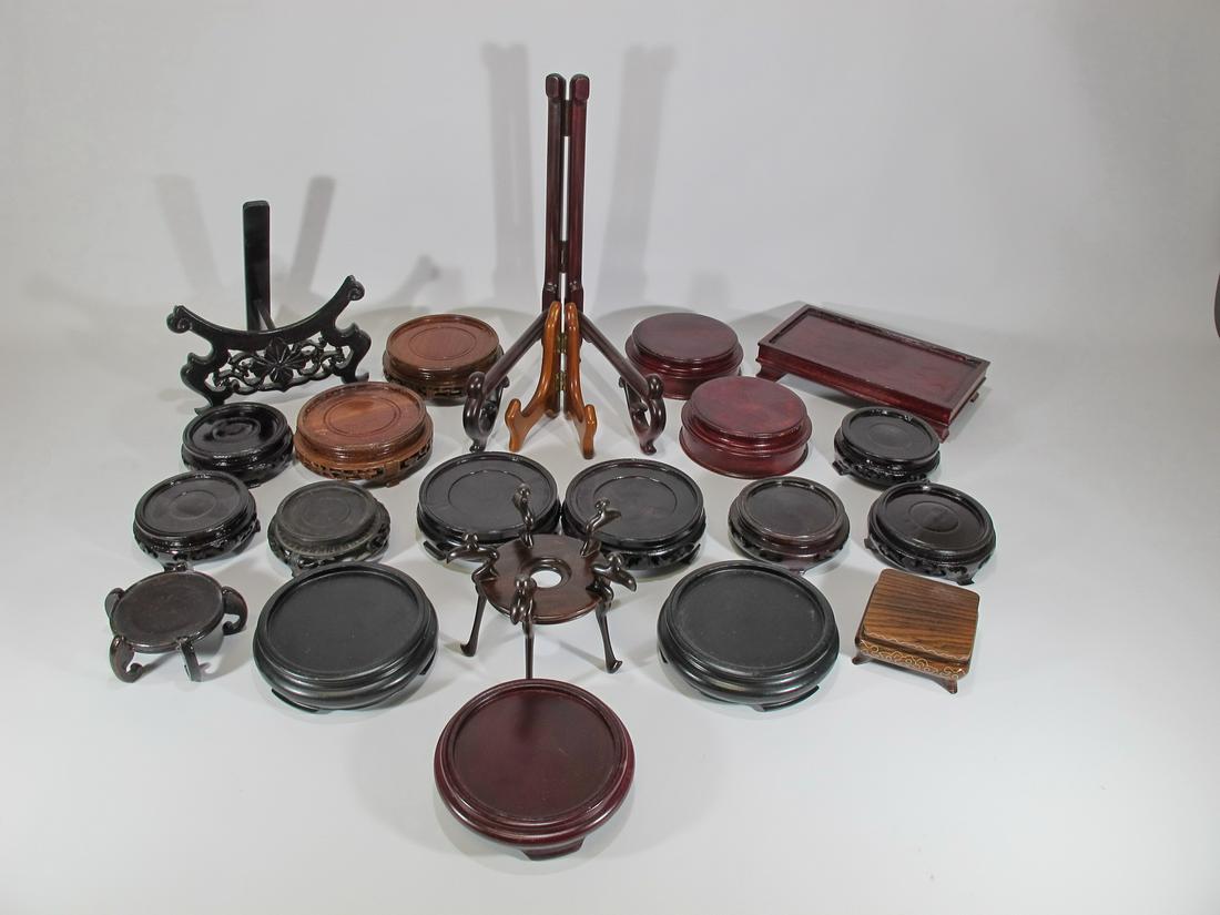 20 Chinese wood bases and 2 plate stands: 20 Chinese wood bases and 2 plate stands. 4 3/8” , 4 1/4”, 3 1/4”, 3 3/4”, 3 1/8”, 4”, etc diameters. Shipping in USA or International please contact for quote both