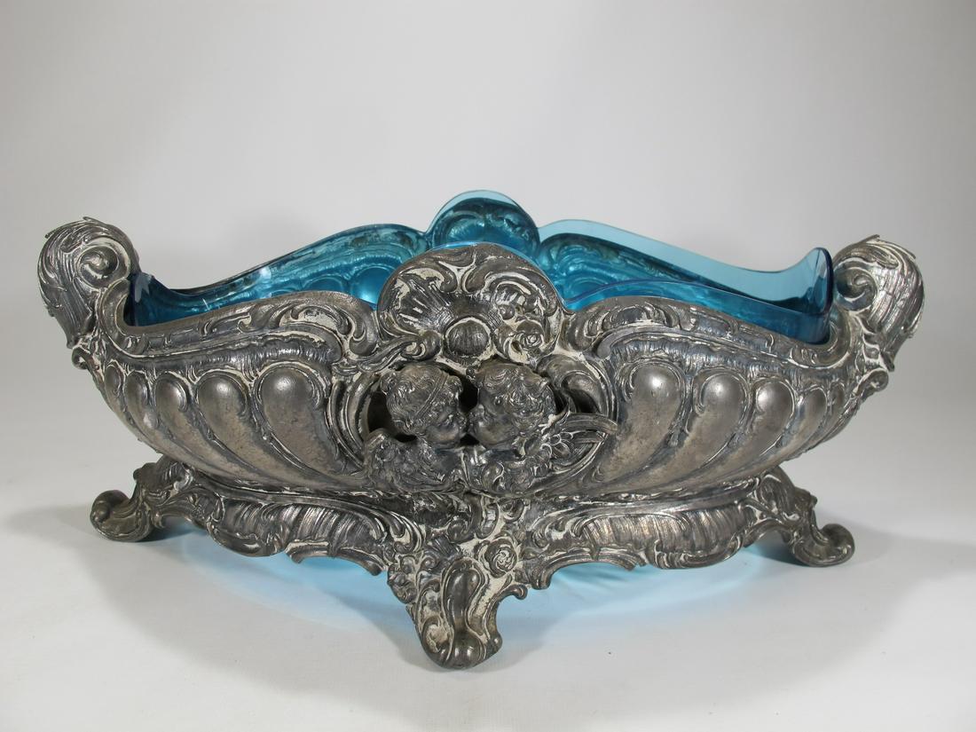 Antique European metal & blue glass centerpiece: Antique European metal & blue glass centerpiece. 6 1/4” H x 15 3/4” W x 8 3/4” D. Shipping in USA or International please contact for quote both UPS stores: 1) : David Reiser UPS sto