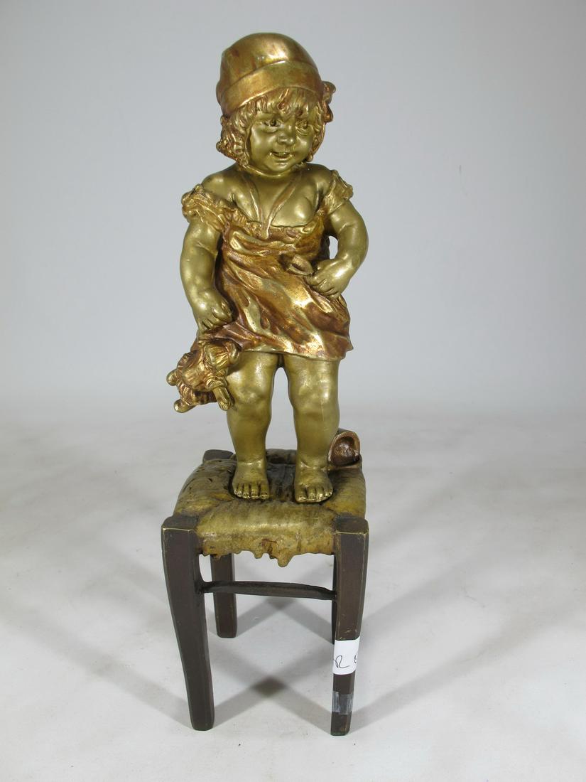 Juan CLARA AYATS (1875-1958) little girl standing at: Juan CLARA AYATS (1875-1958) little girl standing at the stool bronze sculpture, signed. 12 1/4” H x 3 3/8” W x 3 3/8” D. Shipping in USA or International please contact for quote bo