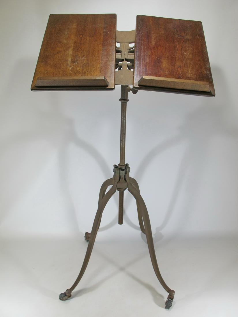 Antique Adjustable Cast Iron & Oak lectern: Antique Adjustable Cast Iron & Oak lectern. 35 3/4” H x 19 1/2” W x 17 1/2” D. Shipping in USA or International please contact for quote both UPS stores: 1) : David Reiser UPS store 