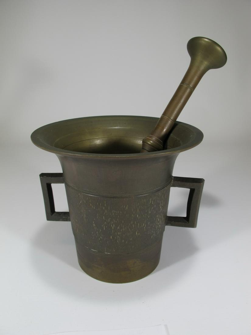 Antique bronze mortar & pestle: Antique bronze mortar & pestle. Mortar: 4 7/8” H x 5 1/2” W x 5 3/8” D. Pestle: 8 1/2” long x 1 5/8” W. Shipping in USA or International please contact for quote both UPS