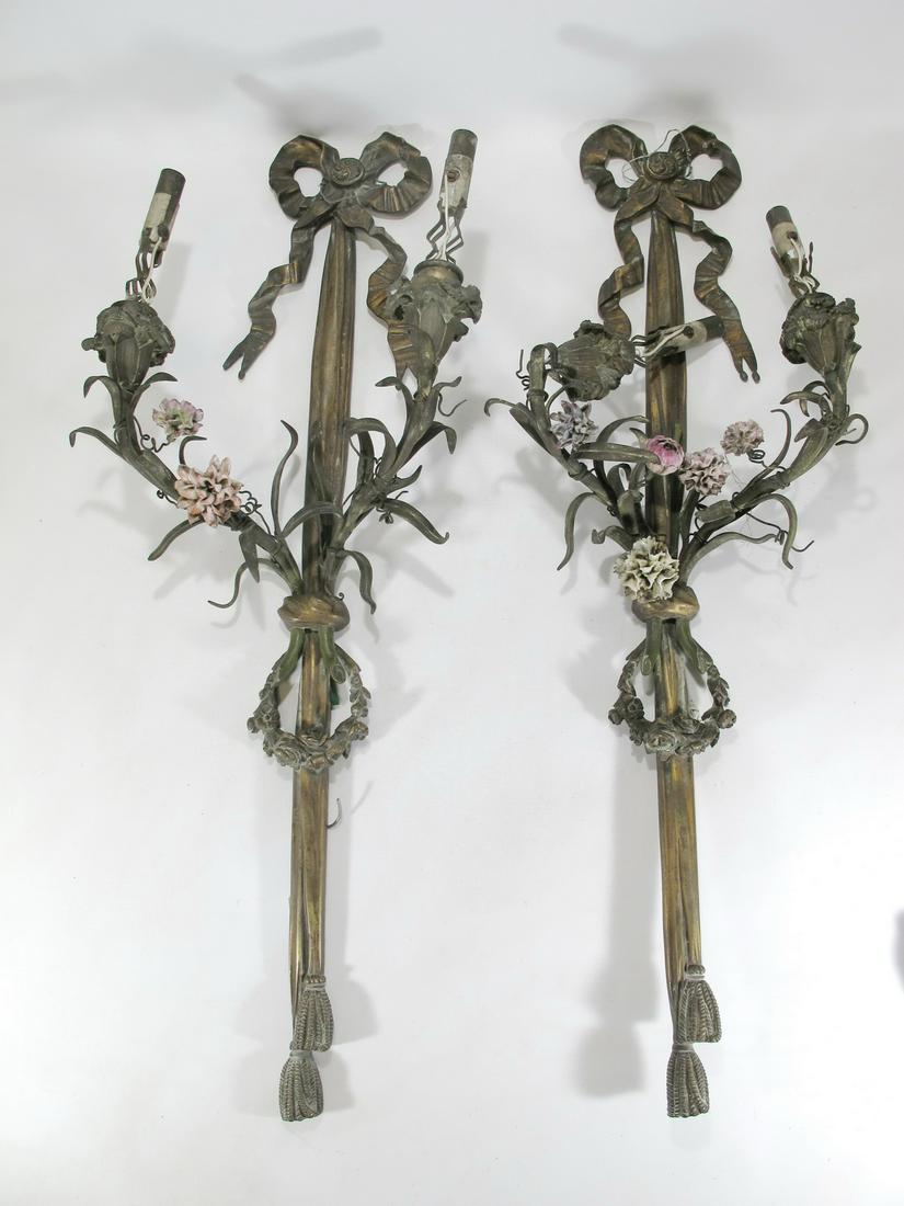 Antique French pair of brionze sconces & porcelain: Antique French pair of brionze sconces & porcelain flowers. 24 3/4” H x 9 1/4” W x 5 3/8” D. Shipping in USA or International please contact for quote both UPS stores: 1) : David Rei