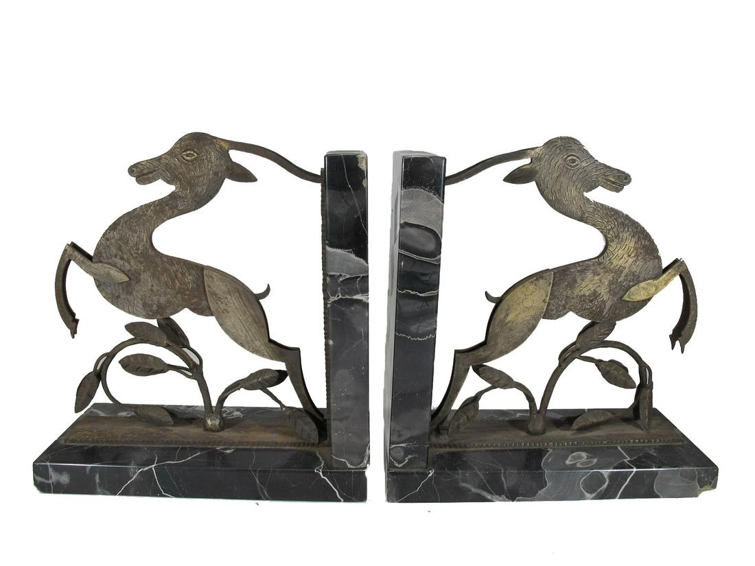 Edgar BRANDT (1880-1960) pair of bookends: Edgar BRANDT (1880-1960) pair of bookends, signed. 7 3/4” H x 7 1/8” W x 3 1/8” D. ANY INVOICE OVER $ 2,000.00 WE WILL ACCEPT PAYMENTS ONLY THROUGH CHECK OR BANK WIRE TRANSFER, SAME 