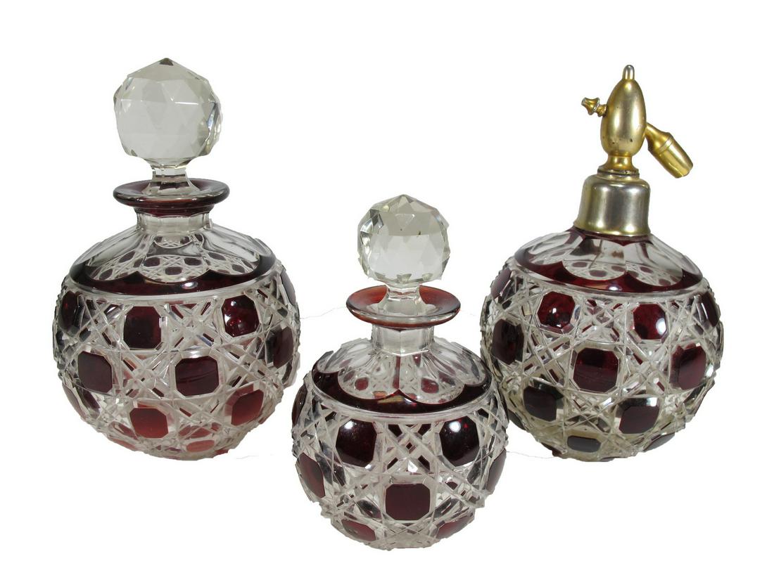 Antique European red cut glass vanity set: Antique European red cut glass vanity set. 7 1/2” H x 4 3/8” W, 7 1/2” H x 4 1/4” W and 5 1/4” H x 3 1/4” W. ANY INVOICE OVER $ 2,000.00 WE WILL ACCEPT PAYMENTS ONL