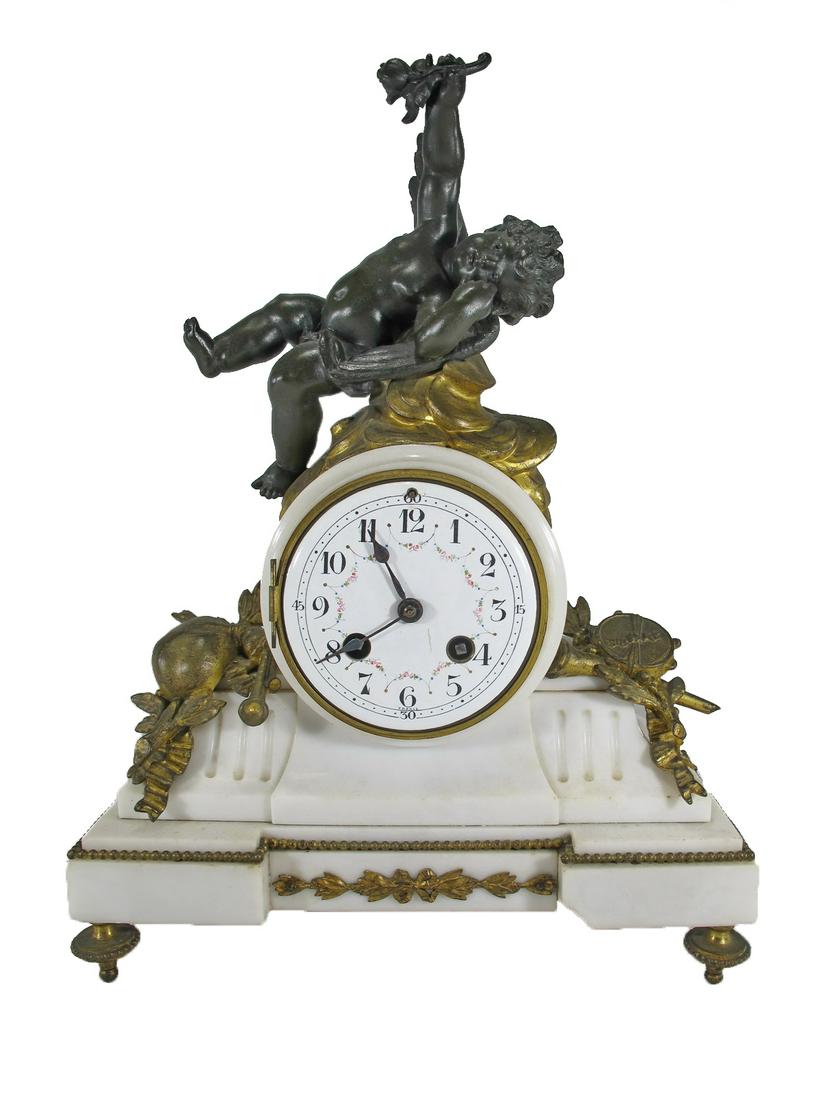 Samuel MARTI French bronze & marble mantel clock: Samuel MARTI French bronze & marble mantel clock. 14 1/4” H x 10 1/4” W x 4 7/8” D. ANY INVOICE OVER $ 2,000.00 WE WILL ACCEPT PAYMENTS ONLY THROUGH CHECK OR BANK WIRE TRANSFER, SAME