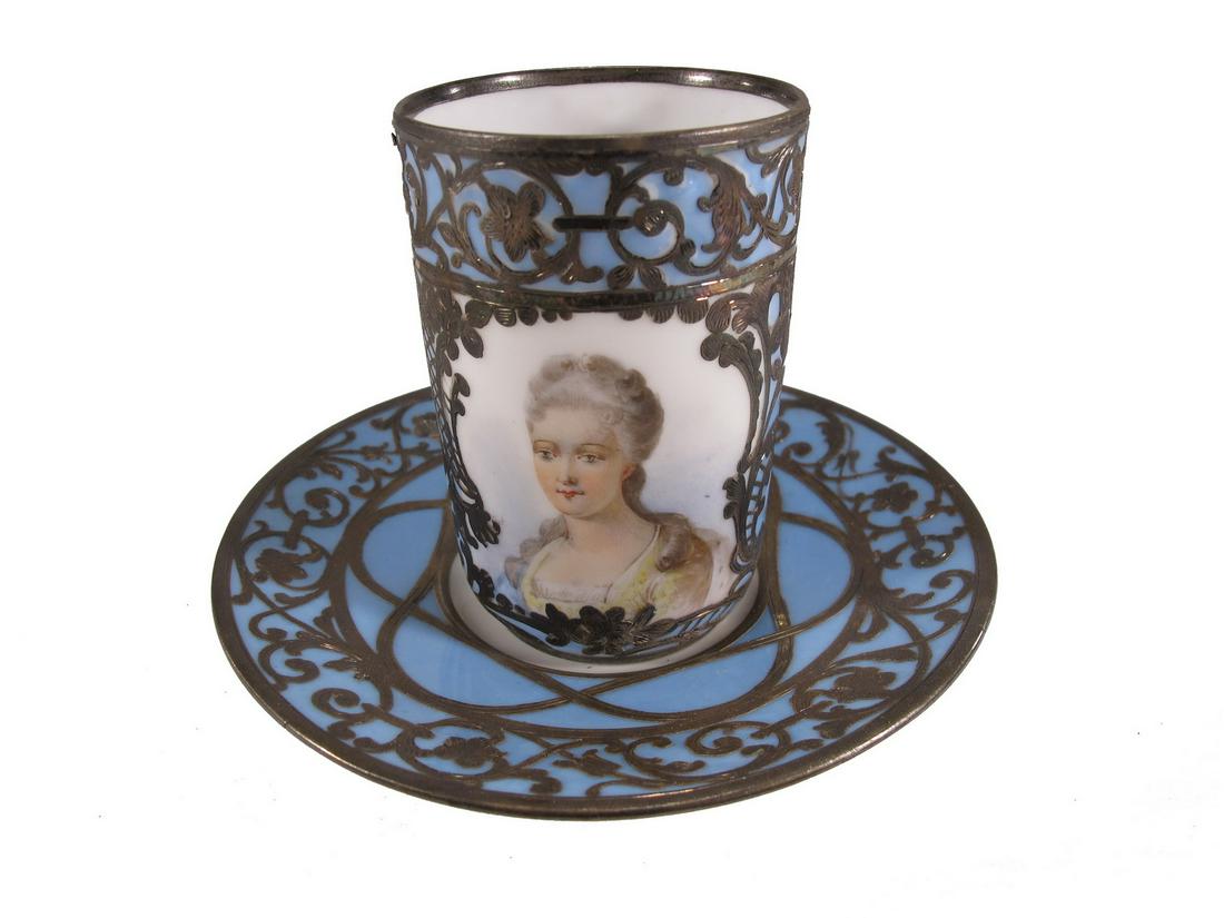 Antique Limoges & Sevres silver overlay porcelain cup: Antique Limoges & Sevres silver overlay porcelain cup. Cup: 3” H x 2” W. Plate: 4 5/8” diameter. ANY INVOICE OVER $ 2,000.00 WE WILL ACCEPT PAYMENTS ONLY THROUGH CHECK OR BANK WIRE T