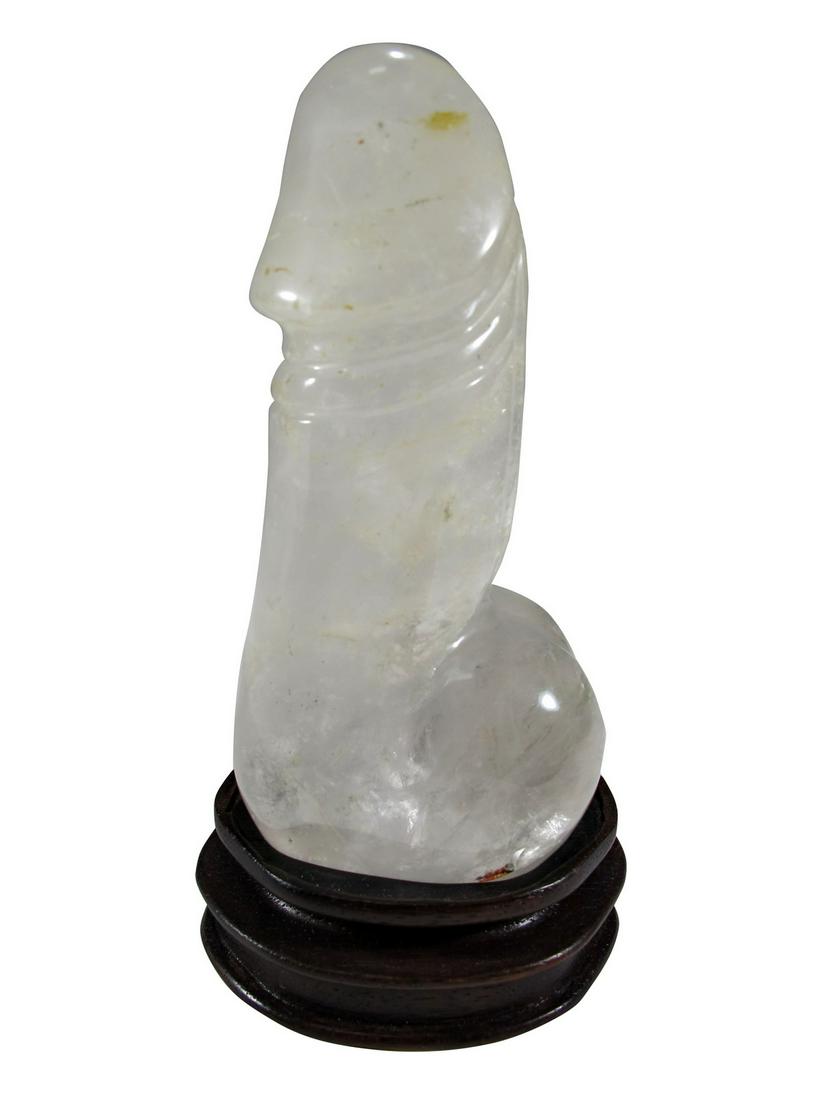 Vintage rock crystal phalus penis sculpture: Vintage rock crystal phalus penis sculpture with a wood base. Penis: 4 3/4” H x 2 3/8” W x 1 3/4” D. Base: 1” H x 2 7/8” W x 2 7/8” D. ANY INVOICE OVER $ 2,000.00 W