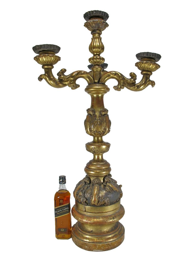 18th/19th C large European gilt wood candellabra: 18th/19th C large European gilt wood candellabra with a wood base. Candelabra: 32 1/4” H x 21” W. Base: 6 1/4” H x 9 1/2” W. ANY INVOICE OVER $ 2,000.00 WE WILL ACCEPT PAYMENTS