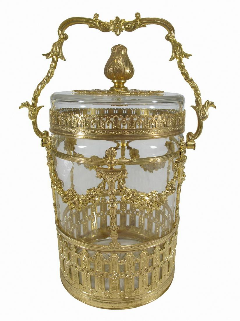 Antique French gilt bronze & glass lided jar: Antique French gilt bronze & glass lided jar. 9 3/8” H x 6 3/8” W x 4 1/2” D with the handle up. 8 1/2” H with the handle down. ANY INVOICE OVER $ 2,000.00 WE WILL ACCEPT PAYME