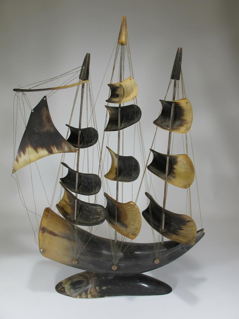 Sailboat model ship made of horn from Santo Domingo: Sailboat model ship made of horn marked with a Sto Domingo flag. 19 1/2” H x 13” W x 4 1/4” D. ANY INVOICE OVER $ 2,000.00 WE WILL ACCEPT PAYMENTS ONLY THROUGH CHECK OR BANK WIRE TRA