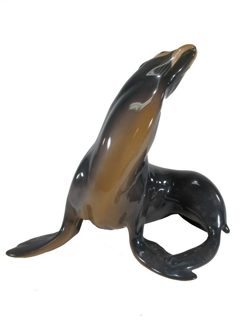 Bing & Grondahl Copenhagen seal porcelain statue: Bing & Grondahl Copenhagen seal porcelain statue. 6 7/8” H x 8” W x 4 5/8” D. ANY INVOICE OVER $ 2,000.00 WE WILL ACCEPT PAYMENTS ONLY THROUGH CHECK OR BANK WIRE TRANSFER, SAME FOR I