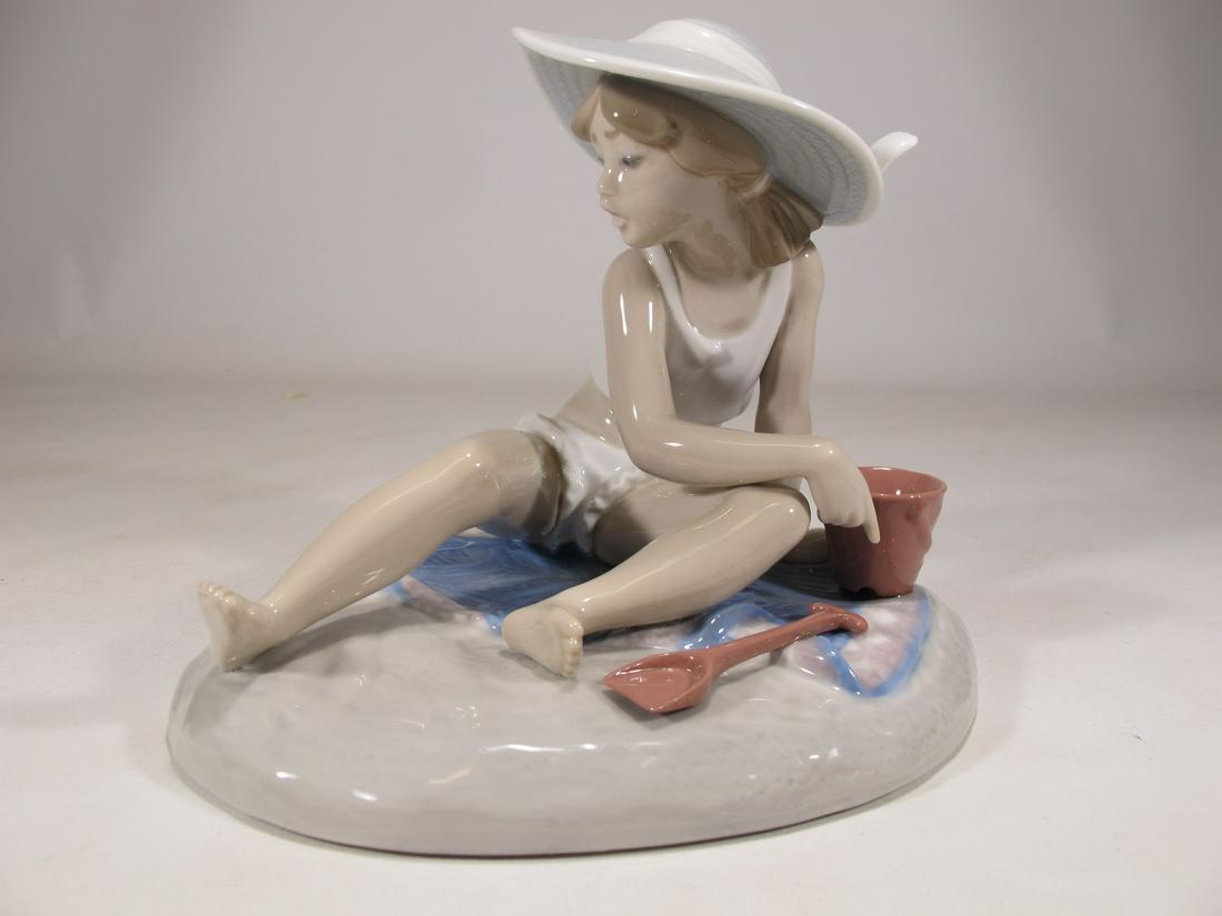 Lladro 5488 Sandcastles porcelain statue: Lladro 5488 Sandcastles porcelain statue, by Regino Torrijos and with the original box. 5 3/8” H x 6 1/4” W x 5 5/8” D. Box: 8” H x 9 1/8” W x 13 1/4” D. ANY INVOIC