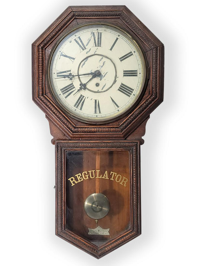 Waterbury Clock Co HERON Regulator wall clock: Waterbury Clock Co HERON Regulator wall clock. 32 1/2” H x 17 1/4” W x 3 7/8” D. ANY INVOICE OVER $ 2,000.00 WE WILL ACCEPT PAYMENTS ONLY THROUGH CHECK OR BANK WIRE TRANSFER, SAME FOR INTERNATIO