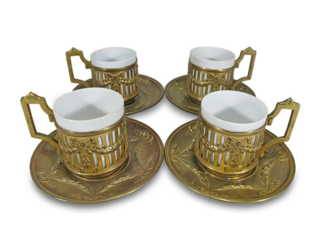 Vintage Lappas & Rosenthal gilt metal & porcelain set: Vintage Lappas & Rosenthal gilt metal & porcelain set of 4 cups. Plate: 4 3/8” diameter. Cups: 2 1/2” H x 2 1/8” W x 3“ D. ANY INVOICE OVER $ 2,000.00 WE WILL ACCEPT PAYMENTS O