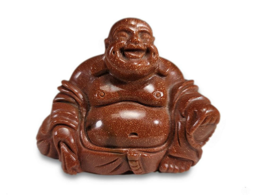 Small shining red stone Buddha statue (1 of 3)