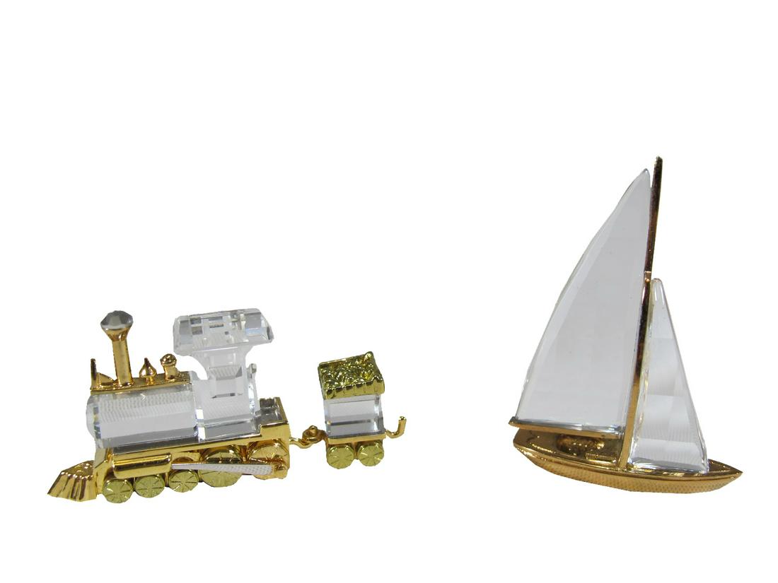 Swarovski ship and locomotive crystal miniature: Swarovski ship and locomotive crystal miniature sculptures. Ship: 1 3/4 in H x 1 1/8 in W x 9/16 in D. ANY INVOICE OVER $ 2,000.00 WE WILL ACCEPT PAYMENTS ONLY THROUGH CHECK OR BANK WIRE TRANSFER, SAM