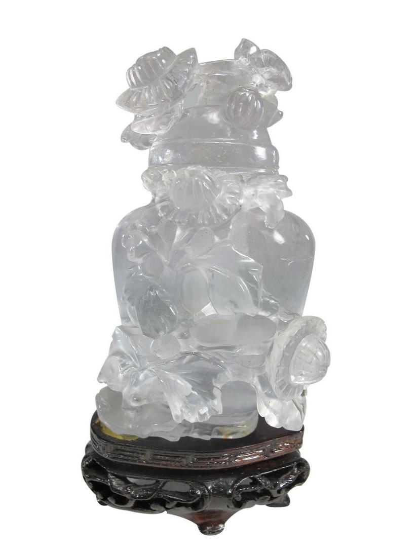 Antique Chinese rock crystal snuff bottle with a wood (1 of 3)