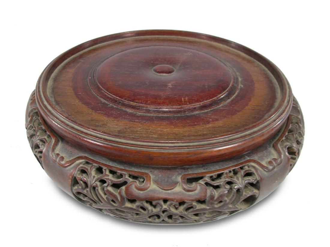 Antique Chinese carved wood base: Antique Chinese carved wood base. 2 1/2 H x 8 3/4 W. Center wide foir a vase is 7. ANY INVOICE OVER $ 2,000.00 WE WILL ACCEPT PAYMENTS ONLY THROUGH CHECK OR BANK WIRE TRANSFER, SAME FOR INTERNATIONAL 