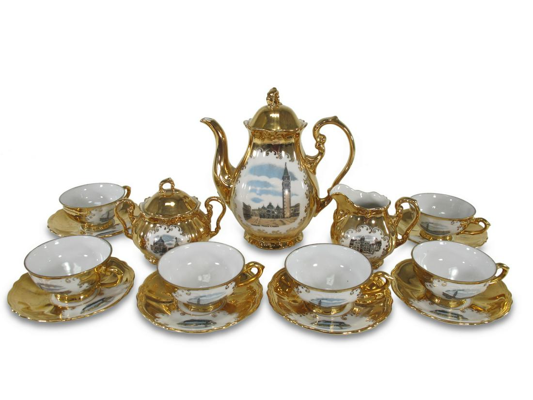 Venezia, Italy gold porcelain teapot set of 17 pcs: Venezia, Italy gold porcelain teapot set of 17 pcs. teapot: 7 1/8 H x 6 1/2 W x 3 3/4 D. Sugarpot: 3 1/2 H x 4 1/2 W x 3 D. Creamer: 3 H x 3 5/8 W x 2 5/8 D. Cup: 1 1/2 H x 3 5/8 W x 3 D. Plate: 4 3/8