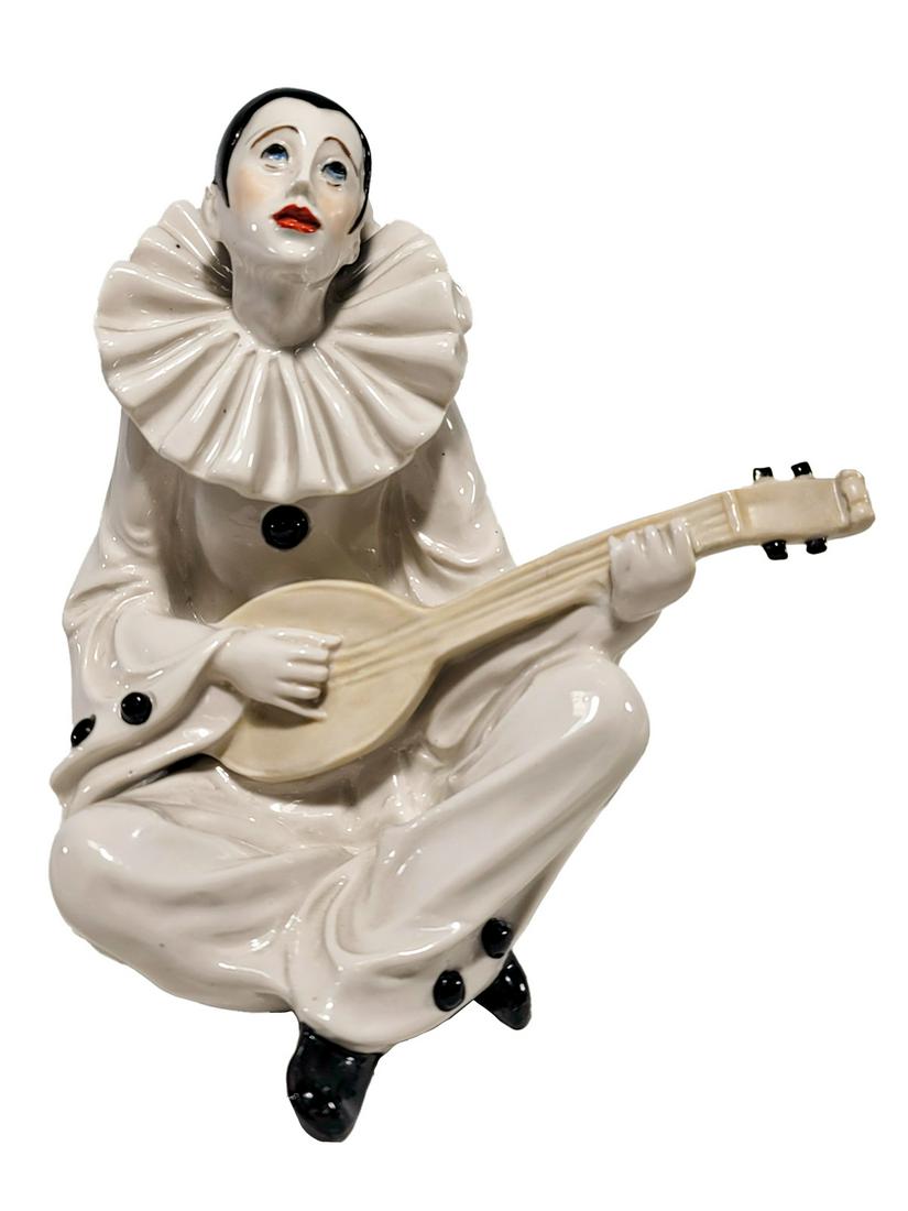 Art Deco Harlequin Playing Guitar Porcelain Statue: Art Deco Harlequin Playing Guitar Porcelain Statue. 6 3/8 x 6 5/8 x 5 1/2 in. TO SHIP THIS ITEM IN USA OR INTERNATIONAL, PLEASE CONTACT THE SHIPPERS : 1) UPS store1937- David Reiser -754-263-0780, auc
