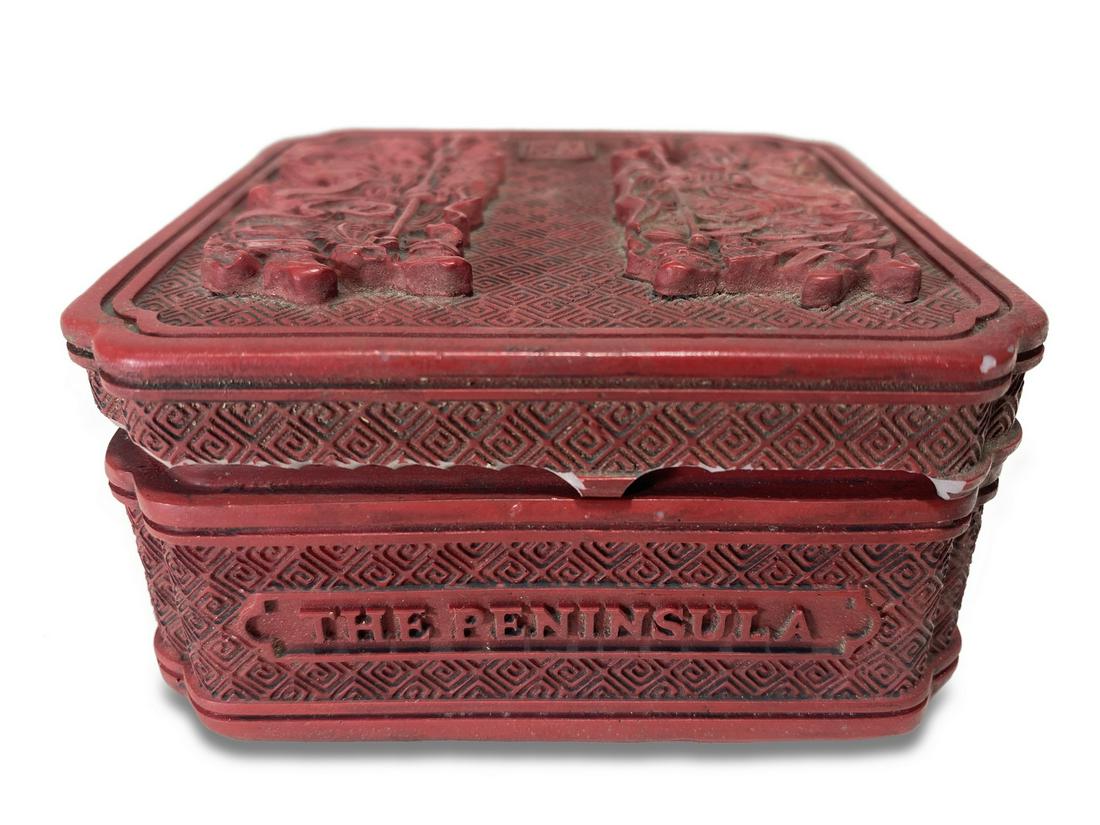 The Peninsula, Hong Kong cinnabar box: The Peninsula, Hong Kong cinnabar box. 1 3/4 x 3 5/8 x 3 5/8 in. TO SHIP THIS ITEM IN USA OR INTERNATIONAL, PLEASE CONTACT THE SHIPPERS : 1) UPS store1937- David Reiser -754-263-0780, auctions1937@gma