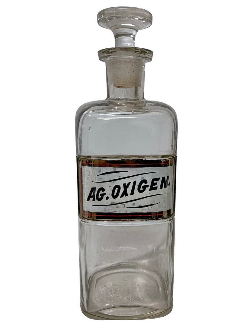 Ag Oxigen Apothecary Glass Bottle: Ag Oxigen Apothecary Glass Bottle. 9 1/2 x 3 1/2 x 3 1/2 inLocal Pick up call one day before to make an appointment. TO SHIP THIS ITEM IN USA OR INTERNATIONAL, PLEASE CONTACT THE SHIPPERS : 1) UPS sto