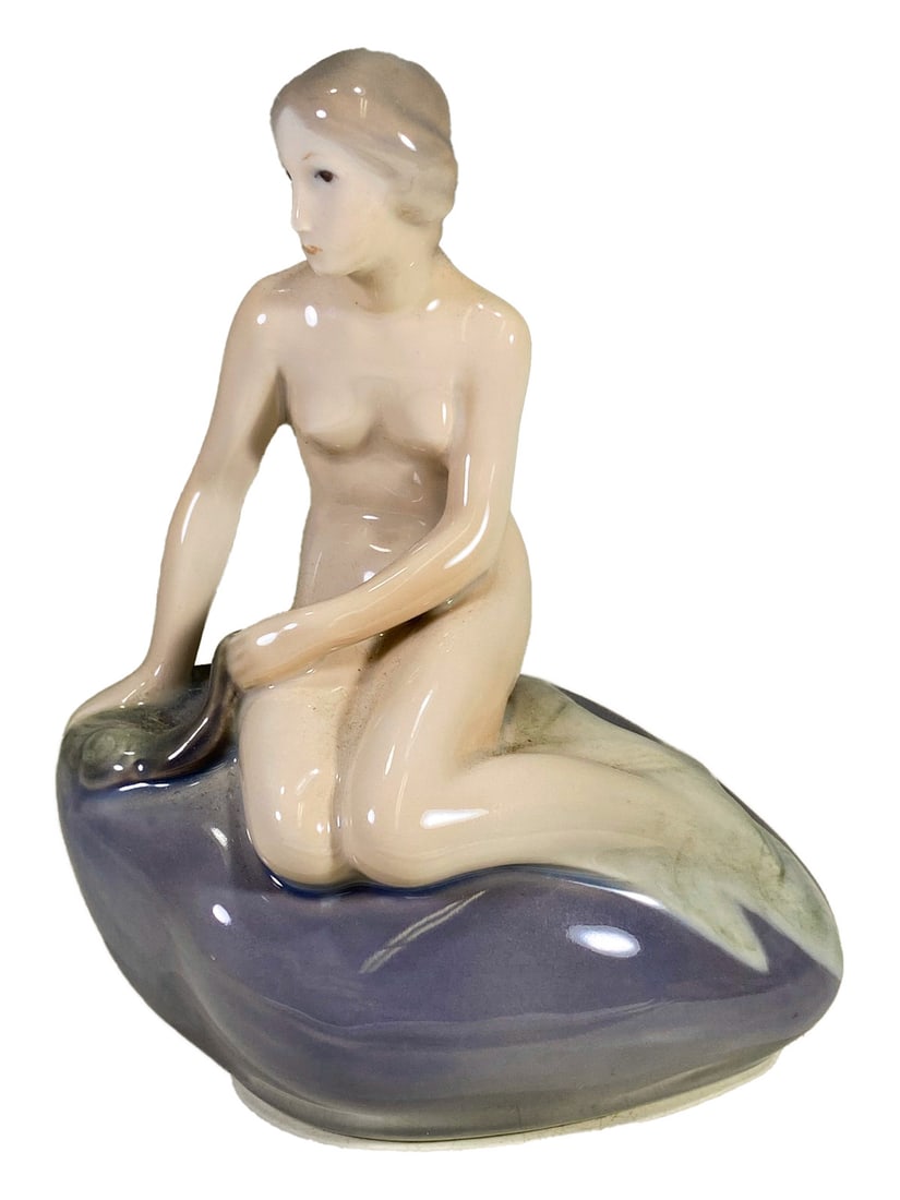 Edvard Eriksen, Royal Copenhagen Nude Porcelain Figurine: Edvard Eriksen, Royal Copenhagen Nude Porcelain Figurine. 5 3/8 x 4 1/8 x 2 5/8 in.Local Pick up call one day before to make an appointment. TO SHIP THIS ITEM IN USA OR INTERNATIONAL, PLEASE CONTACT T