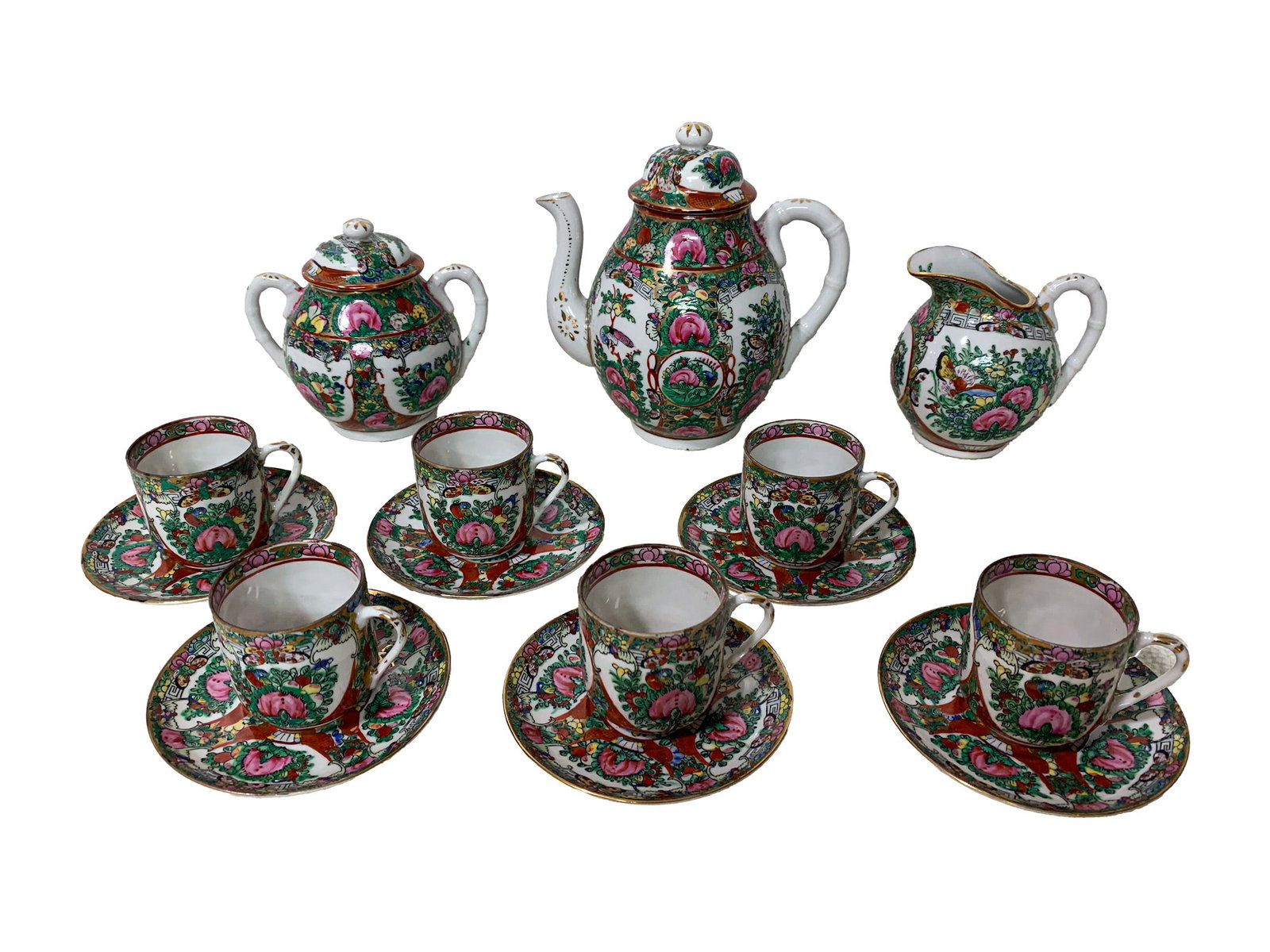 Chinese Famille Rose Porcelain Set: Chinese Famille Rose Porcelain Set. Teapot: 7 x 6 3/8 x 4 1/4 in. Sugarpot: 4 7/8 x 5 1/8 x 3 1/2 in. Creamer: 4 1/8 x 4 1/4 in. Cup: 2 1/4 x 2 3/4 x 2 1/2 in. Plate: 4 1/2 in diameter.Local Pick up c