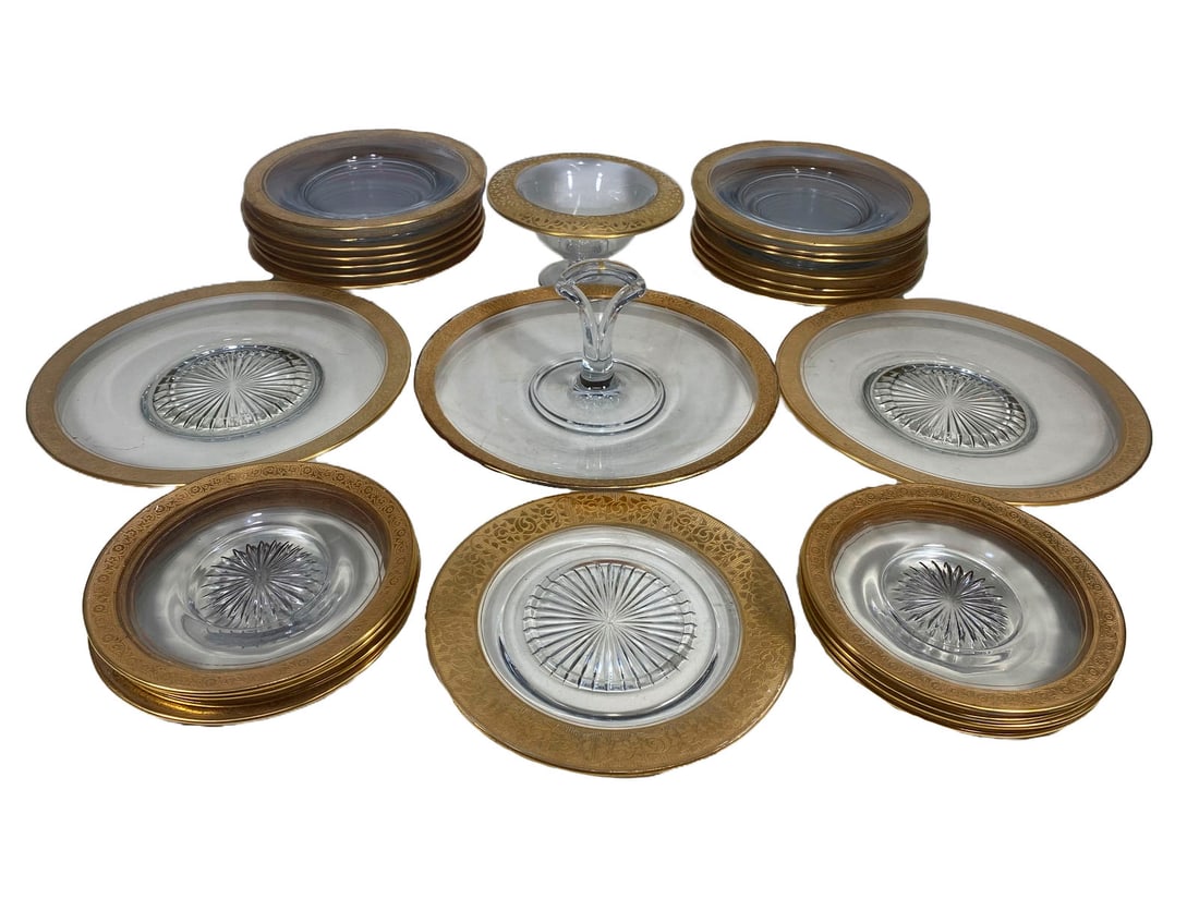 Set of 27 Glass & Gold Rim Service Pieces: Set of 27 Glass & Gold Rim Service Pieces. One plate 8 in diameter, 8 plates 6 5/8 in diameter, 2 plates 10 1/8 in diameter, 3 5/8 x 6 1/2 in, 4 x 10 3/4 in and 14 plates 8 3/8 in diameter.Local Pick