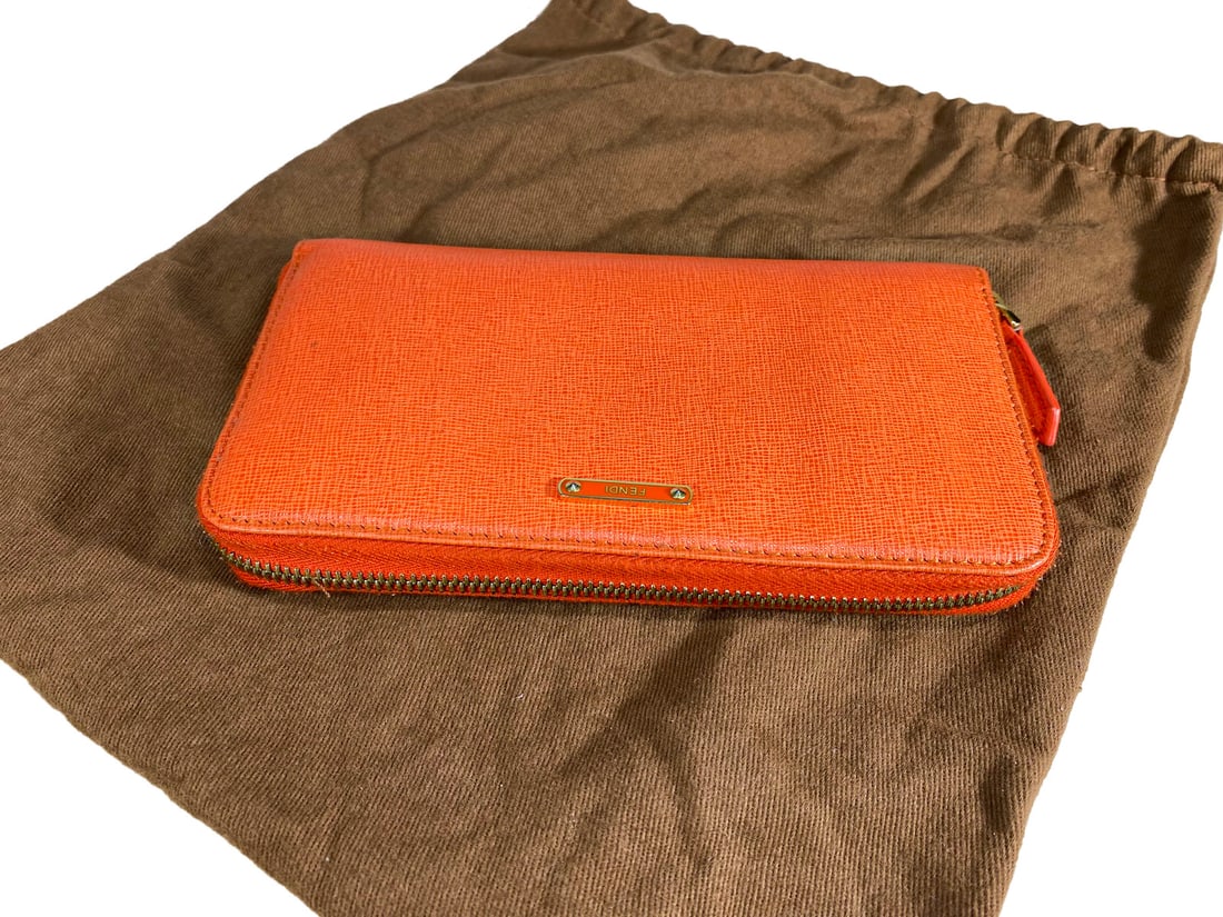 Fendi Orange Zippy Wallet: Fendi Orange Zippy Wallet, we are not sure if original or not. 4 1/8 x 7 3/8 in.Local Pick up call one day before to make an appointment. TO SHIP THIS ITEM IN USA OR INTERNATIONAL, PLEASE CONTACT THE 