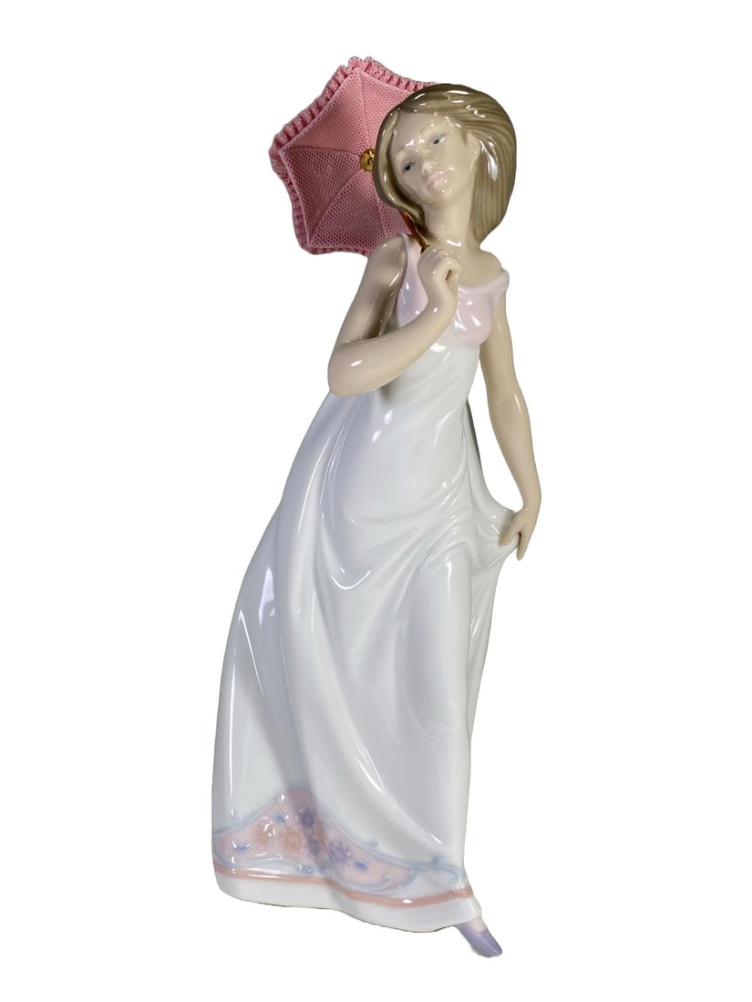 Lladro Afternoon Promenade Porcelain Figurine: Lladro Afternoon Promenade Porcelain Figurine. 10 3/4 x 4 1/2 x 4 1/4 in.Local Pick up call one day before to make an appointment. TO SHIP THIS ITEM IN USA OR INTERNATIONAL, PLEASE CONTACT THE SHIPPER